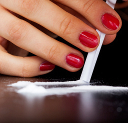 Women with a crack cocaine addiction snorting cocaine